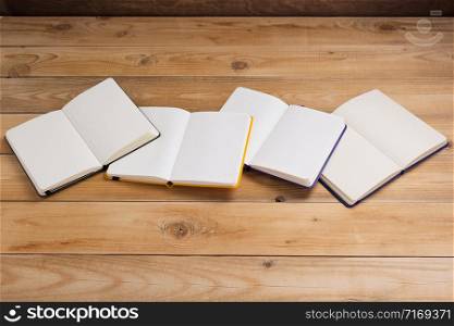 notepad or paper notebook at wooden table background surface table