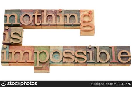 nothing is impossible - motivation concept - isolated text in vintage wood letterpress printing blocks