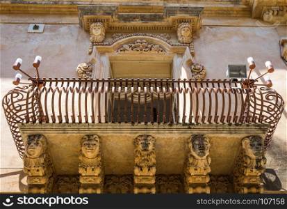 Noto town in Sicily, the Baroque Wonder - UNESCO Heritage Site. Detail of Palazzo Nicolaci balcony, the maximum expression of the Sicilian Baroque style.