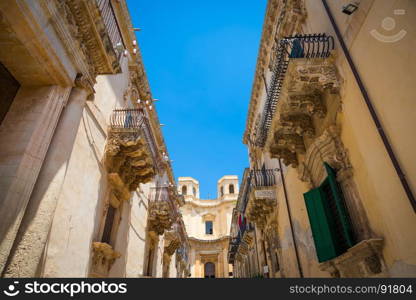 Noto town in Sicily, the Baroque Wonder - UNESCO Heritage Site. Detail of Palazzo Nicolaci balcony, the maximum expression of the Sicilian Baroque style.