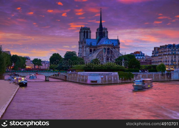 Notre Dame cathedral in Paris sunset from Seine river in France