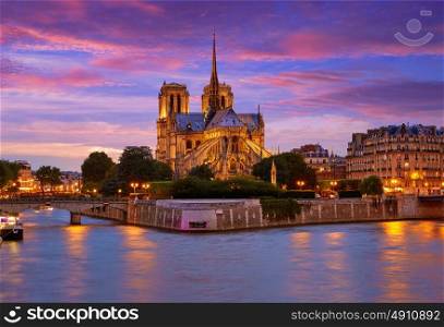 Notre Dame cathedral in Paris sunset from Seine river in France