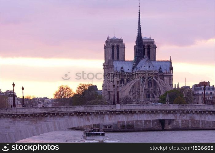 Notre Dame Cathedral on Ile de la Cite and Pont de la Tournelle over Seine river, Paris, France