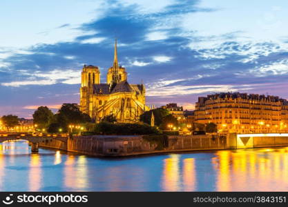 Notre Dame Cathedral with Paris cityscape and River Seine at dusk, France