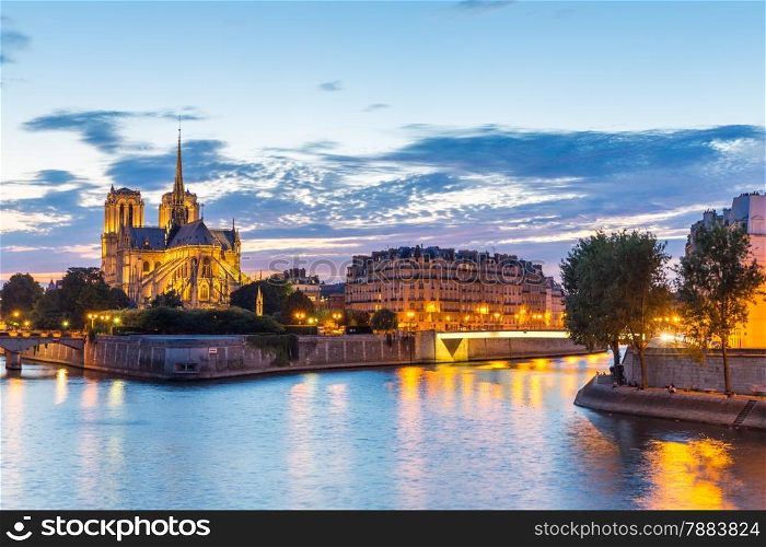 Notre Dame Cathedral with Paris cityscape and River Seine at dusk, France