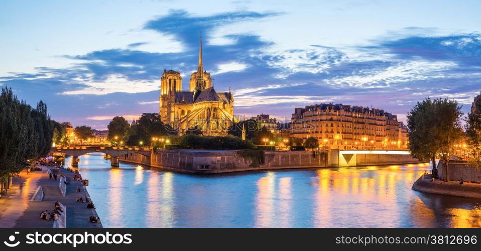 Notre Dame Cathedral with Paris cityscape panorama at dusk, France