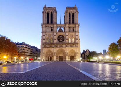 Notre Dame de Paris in the night light at dawn. Paris. France.. Paris. The building of the Cathedral of Notre Dame.