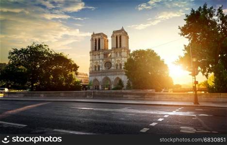 Notre Dame de Paris near road at sunset, France