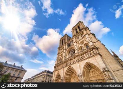 Notre Dame majestic facade against a beautiful blue sky, Paris