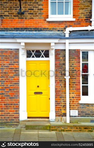 notting hill in london england old suburban and antiqueyellow wall door