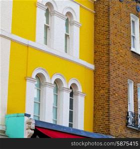 notting hill in london england old suburban and antiqueyellow wall door