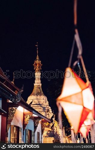 NOV 17, 2013 Chiang Mai, Thailand - Old historic Chiang Mai Lanna style Wat Mahawan temple pagoda with Yi Peng Lanterns in Loy Krathong festival