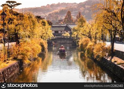 Nov 19, 2014 Kurashiki, Japan   Boat in old canal of Kurashiki, Okayama, Japan.