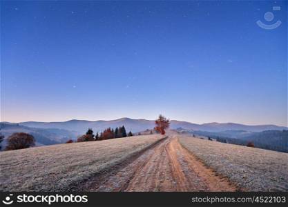 November cold frosty dawn in Carpathian mountains. Morning stars.