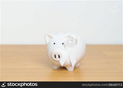 November Lung Cancer Awareness month, White Ribbon with Piggy Bank for support illness life. Health, Donation, Charity, C&aign, Money Saving, Fund and World cancer day concept
