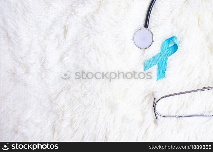 November Prostate Cancer Awareness, light Blue Ribbon with stethoscope for supporting people living and illness. Diabetes day, International men and World cancer day concept