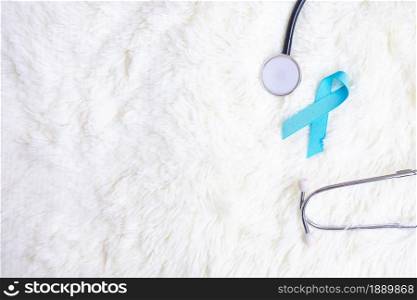 November Prostate Cancer Awareness, light Blue Ribbon with stethoscope for supporting people living and illness. Diabetes day, International men and World cancer day concept
