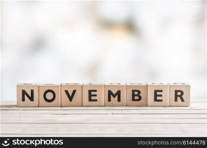 November sign with wooden blocks on a table