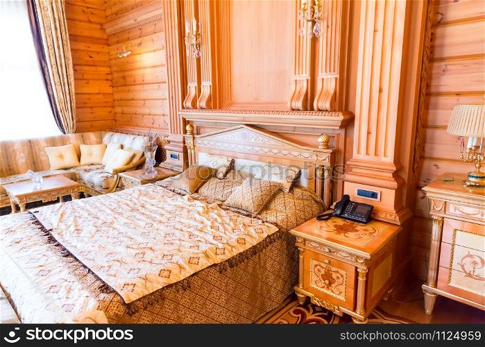 Novi Petrivtsi, Ukraine - May 27, 2015 Mezhigirya residence of ex-president of Ukraine Yanukovich. Owner&rsquo;s bedroom with modern interior. Mezhigirya residence of Yanukovich