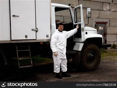 Nuclear plant worker in a white protective suit