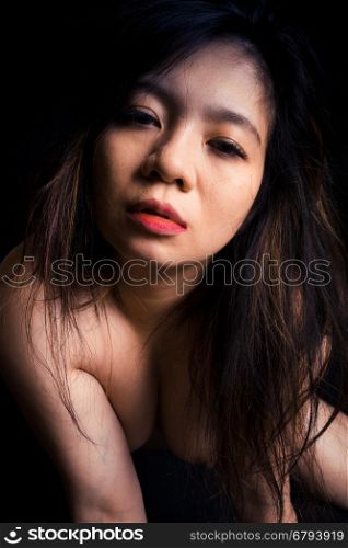 Nude Asian woman nude on black background