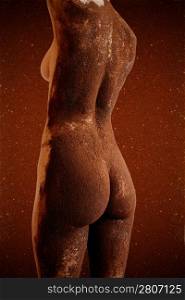 Nude back on woman against brown