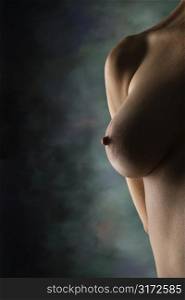 Nude Caucasian female breast and shoulder.
