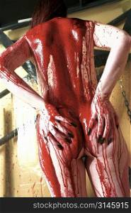 Nude female figure study dripping in blood, a very gothic image.