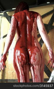 Nude female figure study dripping in blood, a very gothic image.