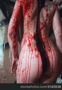 Nude female figure study dripping in blood, a very gothic image.