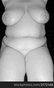 Nude full-figured Caucasian woman.