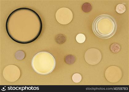 nude make up products beige background