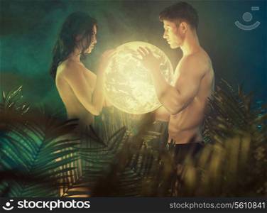 Nude people holding the shiny Earth