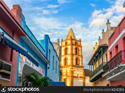 Nuestra Senora de la Soledad church and Spanish colonial colorful decorated houses with balconies, in the center of Camaguey, Cuba