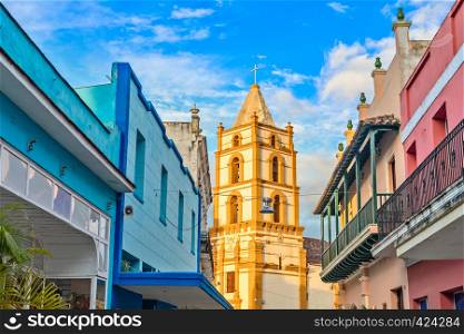 Nuestra Senora de la Soledad church and Spanish colonial colorful decorated houses with balconies, in the center of Camaguey, Cuba