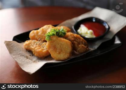 Nuggets on wood background vintage style , appetizer