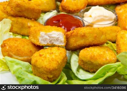 nuggets with ketchup and mayonnaise