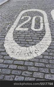 Number 20 painted on cobbled street in London; UK