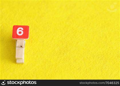 Number 6 displayed on a yellow background