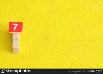 Number 7 displayed on a yellow background