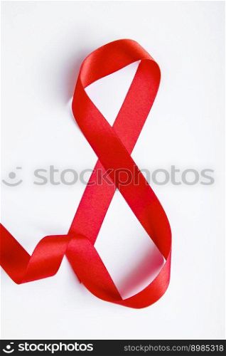 Number 8 from red silk ribbon on white background. International women’s day symbol. Spring holiday on March 8.. Number 8 from red silk ribbon on a white background. International women’s day symbol. Spring holiday on March 8.