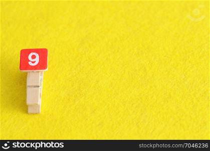 Number 9 displayed on a yellow background
