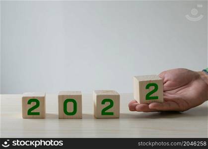 Number Ideas 2022 Happy New Year. The green number that the wooden cube is holding.