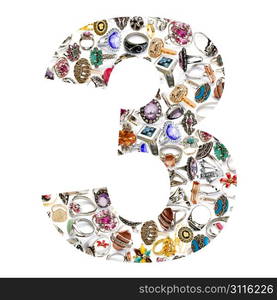 Number made of jewellery rings on white