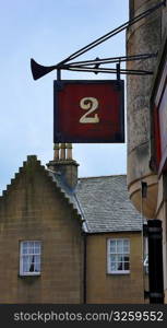 Number two sign above Scottish pub.
