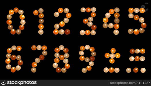 numeral font formed of multicoloured tea candles (isolated on black)