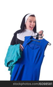 Nun choosing clothing on the hanger isolated on white