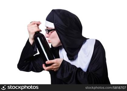 Nun with bottle of wine on white