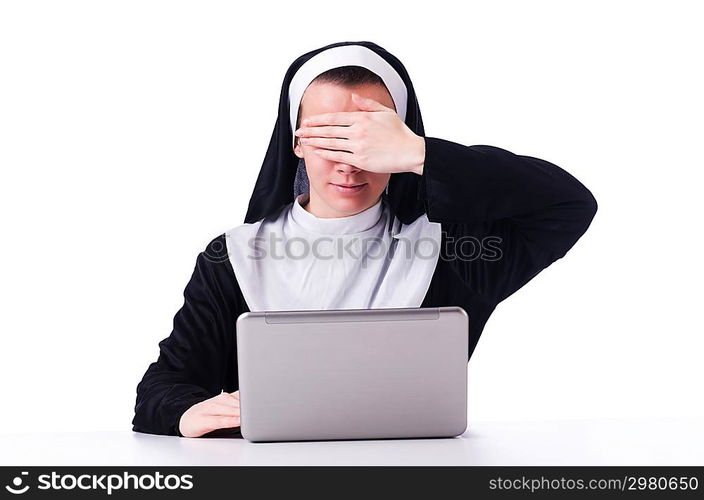 Nun working on laptop - religious concept