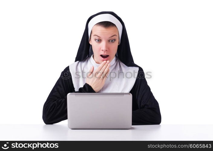 Nun working on laptop - religious concept